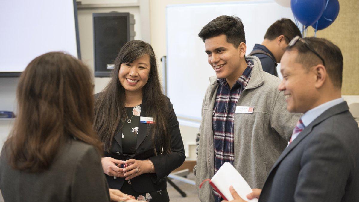 A student discusses finances with Saint Mary's employees.